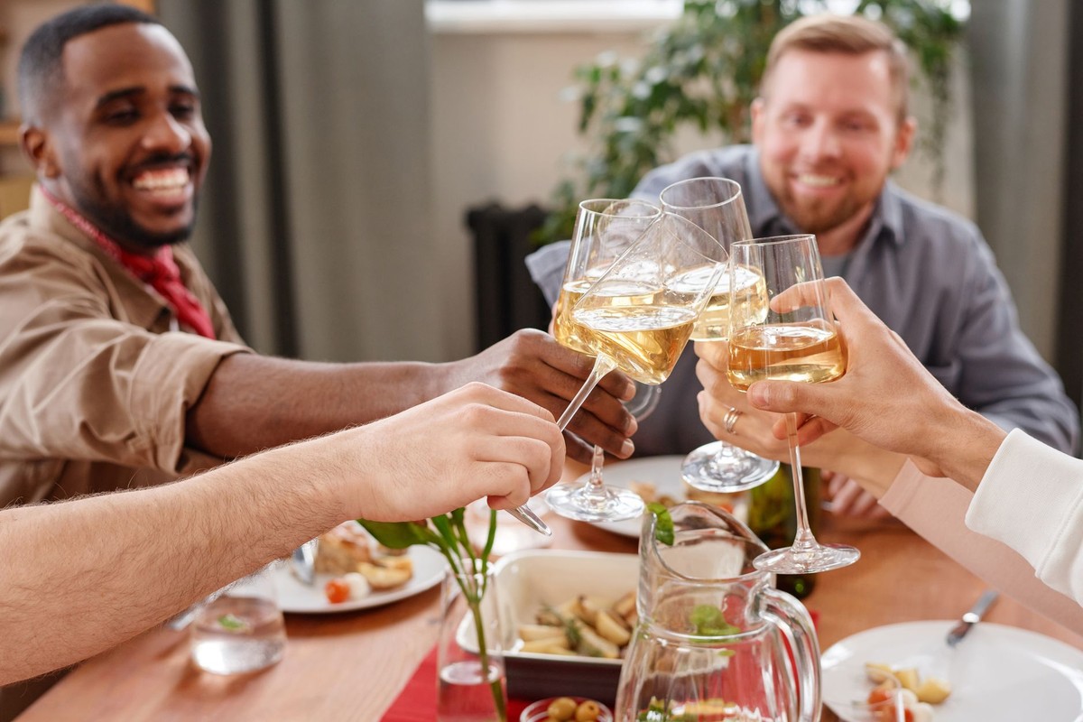 Men raising a toast together around a table